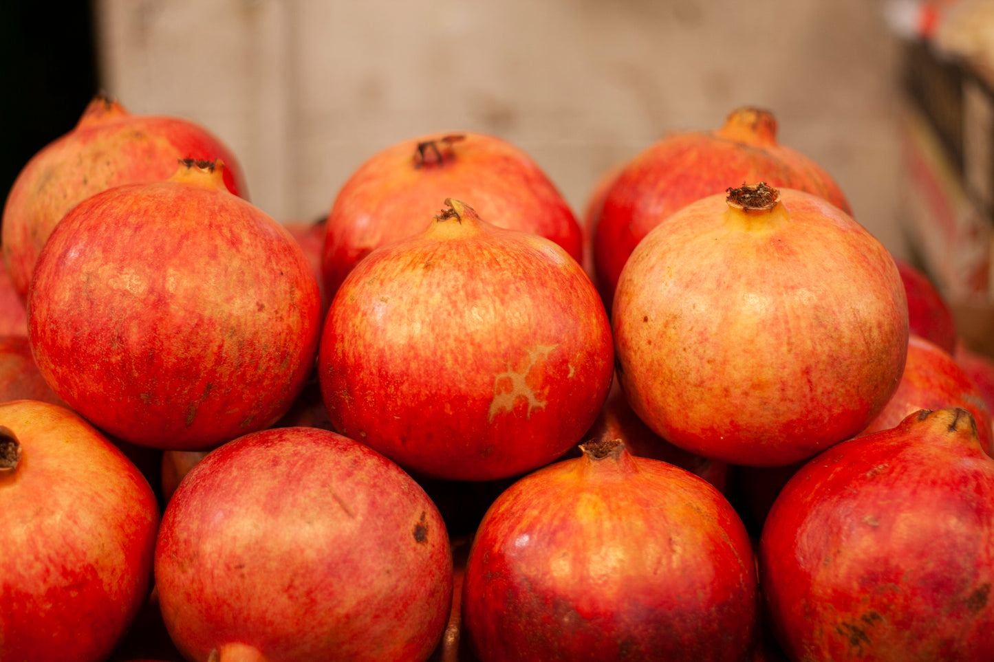 Pomegranates at the market stall ready for sale now