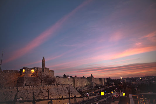 Sunset with a view of the Tower of David and the walls of the Old City of Jerusalem