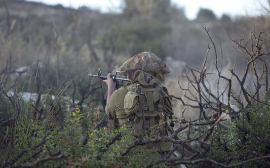 An IDF soldier fires a weapon in military training