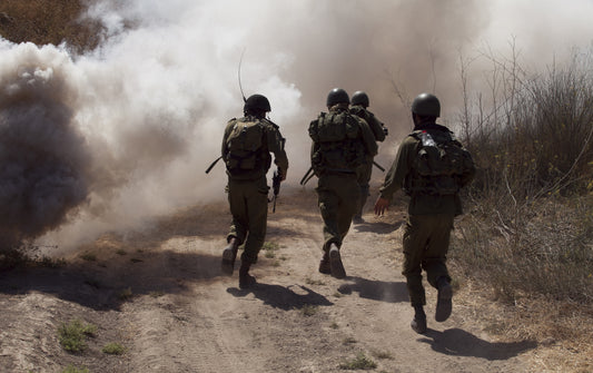 Soldiers ran through thick smoke